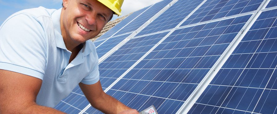 Man installing solar panels for solar power